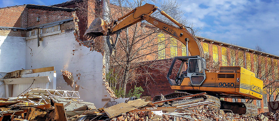 CASE Excavator used by Charlotte Demolition Contractor W.C. Black and Sons to demolish an old commercial building in the NoDa area.