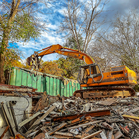 Charlotte Demolition Contractor loads demolition debris with CASE Excavator. Image by W.C. Black and Sons, Inc.